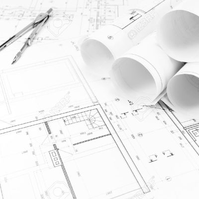 27077790-Architectural-background-with-floor-plans-and-rolls-of-technical-drawings-Stock-Photo.jpg